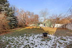 View of yard covered in snow