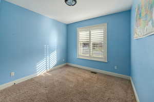 Unfurnished room with carpet