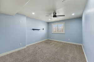 Empty room with carpet flooring and ceiling fan