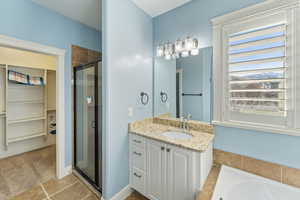 Bathroom with vanity and independent shower and bath