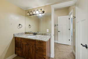 Bathroom with tile patterned flooring and vanity