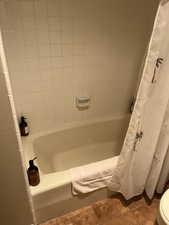 Bathroom featuring tile patterned flooring and toilet