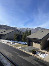 Exterior space featuring a mountain view and a garage