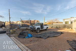 View of vehicle parking with a trampoline