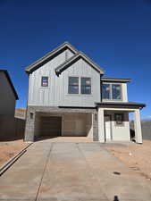 View of front of property featuring a garage