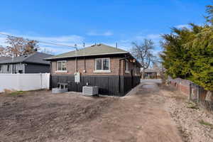 Back of property featuring central air condition unit