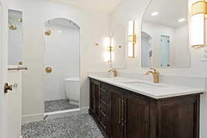 Bathroom featuring tile patterned flooring and vanity