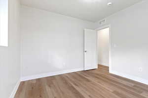 Empty room featuring light hardwood / wood-style floors