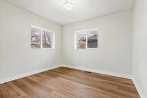 Empty room featuring hardwood / wood-style floors