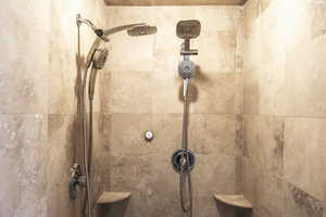 Room details featuring tiled shower