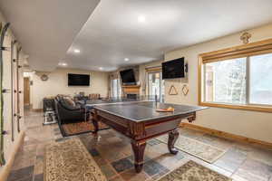 Playroom featuring a large fireplace