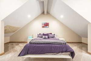 Bedroom featuring carpet and lofted ceiling with beams