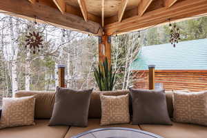 View of patio with an outdoor hangout area