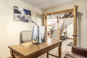 Home office featuring wood-type flooring