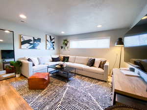 Downstairs Living room with hardwood / wood-style floors