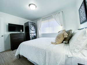 Upstairs Queen Bedroom featuring stacked washing maching and dryer