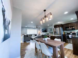 Upstairs Dining room with hardwood / wood-style floors and ceiling fan