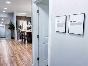 Upstairs Corridor to Bathroom/Kitchen featuring light wood-type flooring