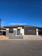 Prairie-style house featuring a garage