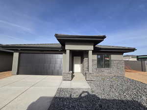 Prairie-style house featuring a garage