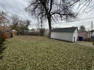 View of yard with an outbuilding