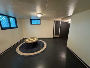 Unfurnished room with concrete flooring