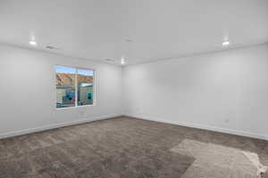 Unfurnished room featuring carpet flooring