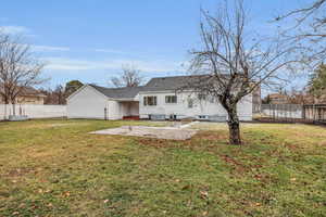 Rear view of house with a patio wired for hot tub