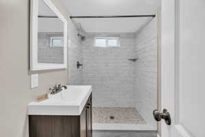 New bathroom with vanity and a tile shower