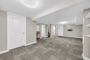 Basement featuring a textured ceiling