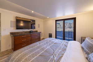 Bedroom featuring access to outside and light hardwood / wood-style floors