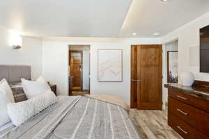 Bedroom with light wood-type flooring and recessed lighting