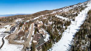 Snowy aerial view featuring a mountain view