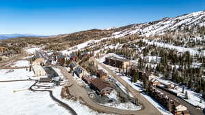 Snowy aerial view with a mountain view