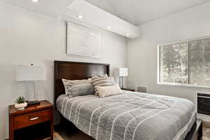 Bedroom with recessed lighting and lofted ceiling