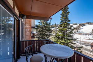 View of snow covered back of property