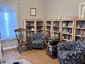 Living area with hardwood / wood-style flooring