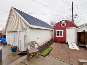 View of outbuilding with a garage