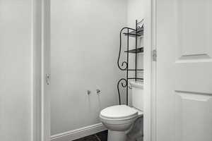 Bathroom with tile patterned floors and toilet