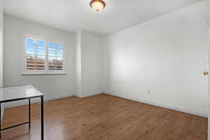 Unfurnished room featuring hardwood / wood-style flooring