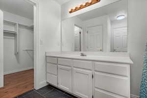 Bathroom featuring tile patterned floors and vanity