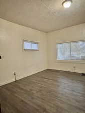 Unit #2 - Bedroom with dark wood-type flooring