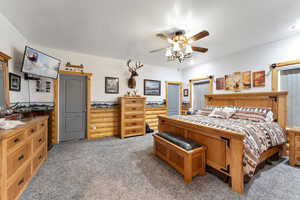 Bedroom featuring light carpet and ceiling fan