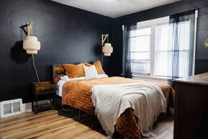 Bedroom featuring hardwood / wood-style flooring