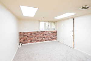 Unfurnished room with carpet flooring