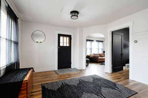 Entrance foyer featuring hardwood / wood-style flooring