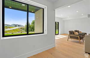 Interior space with a healthy amount of sunlight and light hardwood / wood-style floors