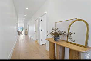 Corridor with light hardwood / wood-style floors