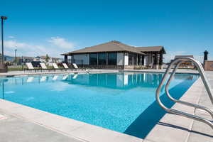 View of swimming pool with a patio area