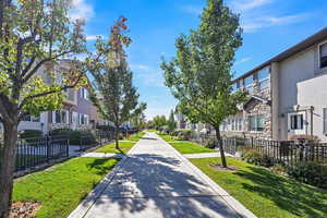 View of home's community featuring a lawn